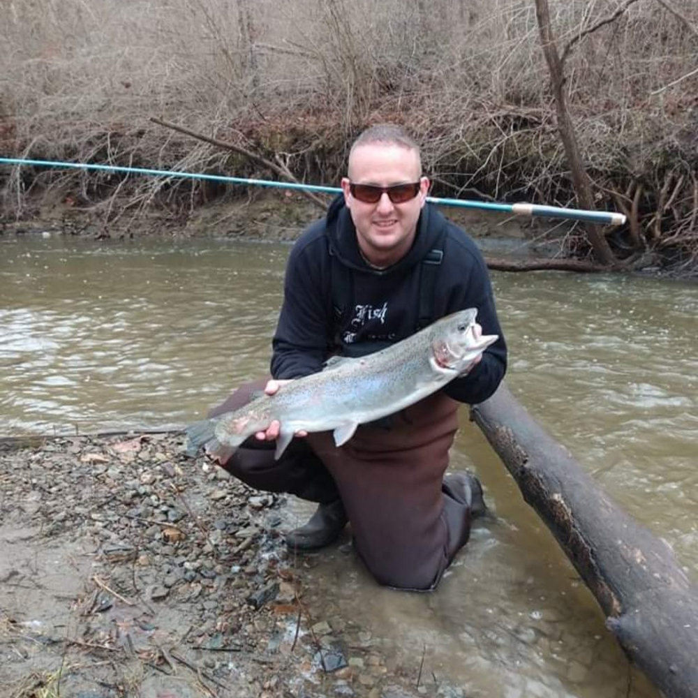 The Maruki Sharpshooter Tenkara rod with a customer catching a Steelhead.